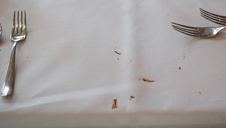 Dirty Tablecloth Stained With Chocolate Forks in picture